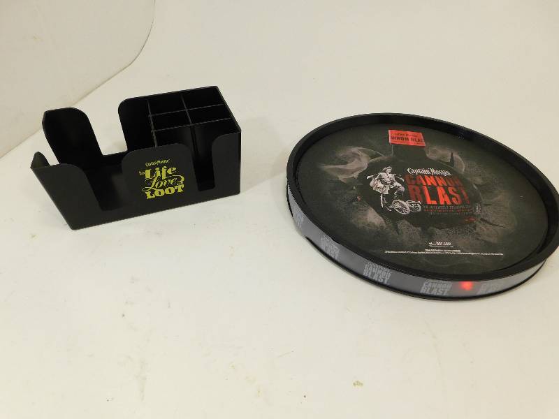 lot 59 image: Captain Morgan Cannon Blast Round Beverage Tray and Napkins, Straws, Coasters Holder