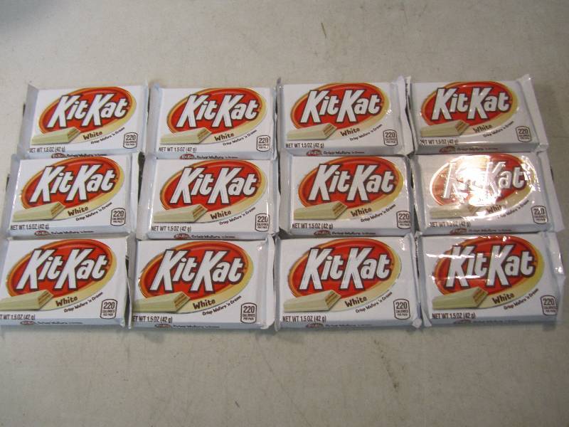 lot 216 image: 12 Kit Kat White Candy Bars Best by...