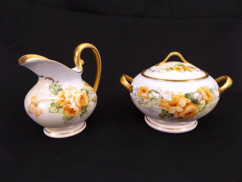 lot 10 image: Limoges France Creamer, Sugar Bowl, Tea Cup, and Saucers
