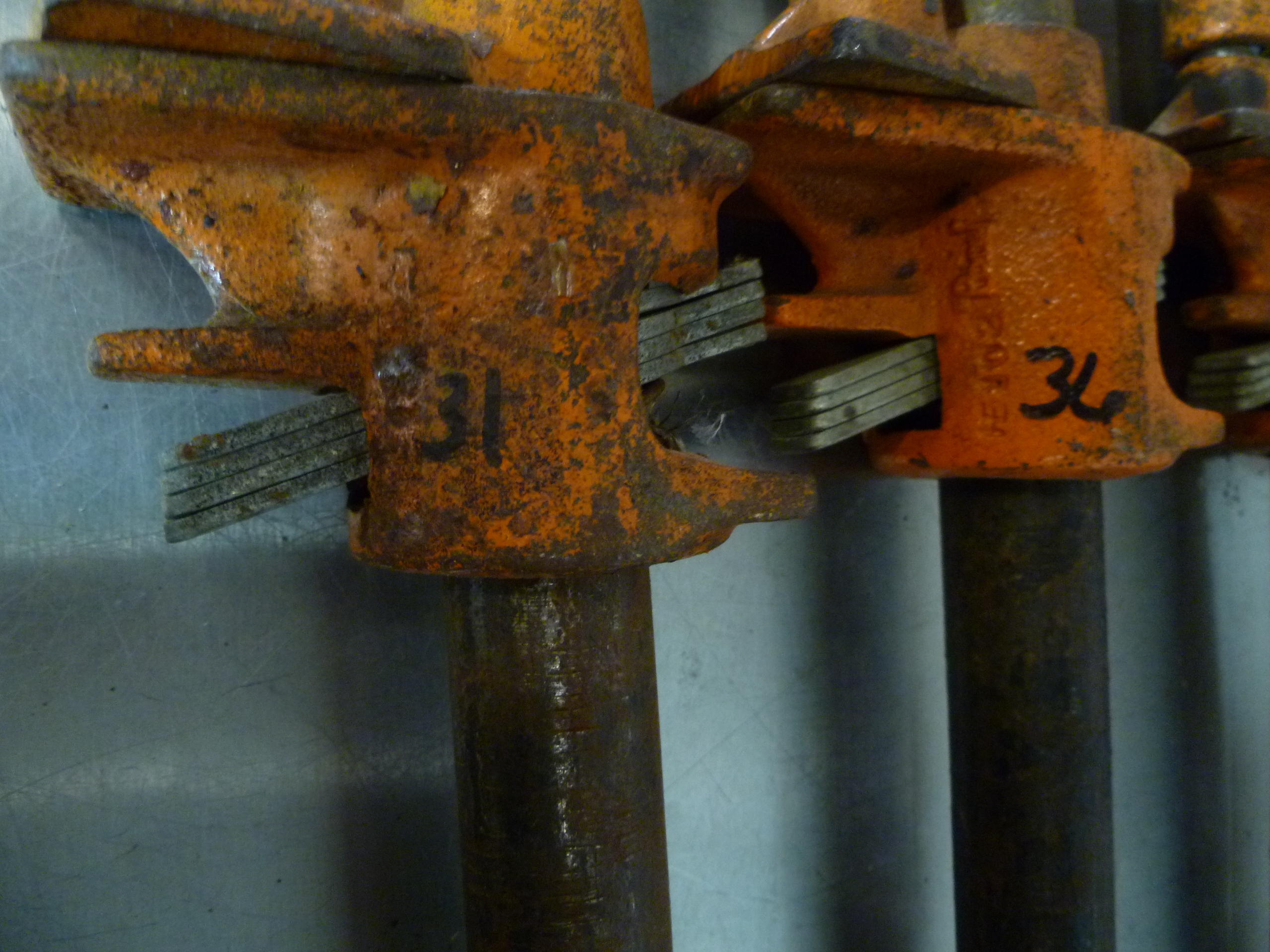 lot 93 image: 4 Pole Clamps