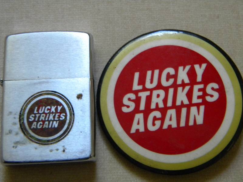 lot 42 image: Zippo Lighter & Pinback Lucky Strikes Again