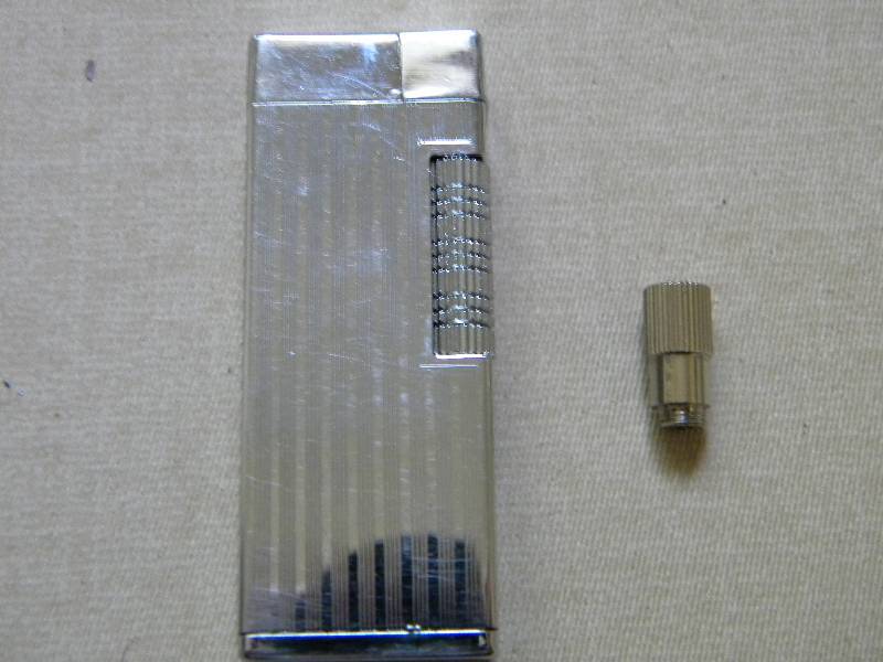 lot 44 image: JJJ Butane Lighter