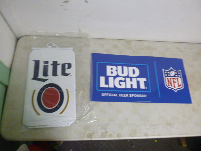 lot 174 image: Miller Lite and Bud Light Been Tin Signs