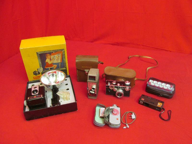 lot 53 image: Brownie Hawkeye in Original Box, Bell and Howell 252 Movie Camera, Vintage 35 mm (no name), Kodak Instamatic, Adams Pocket Flash Gun