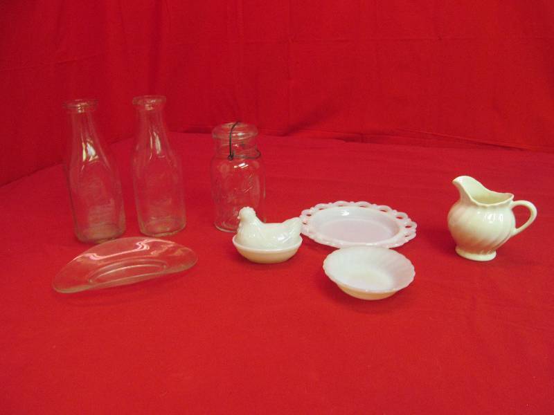 lot 98 image: 2 Vintage Glass 1 Qt. Milk Bottles, Small Hen on a Nest, Fostoria Curved Plate, Lace Edge Milk Glass Plate, Cream Pitcher