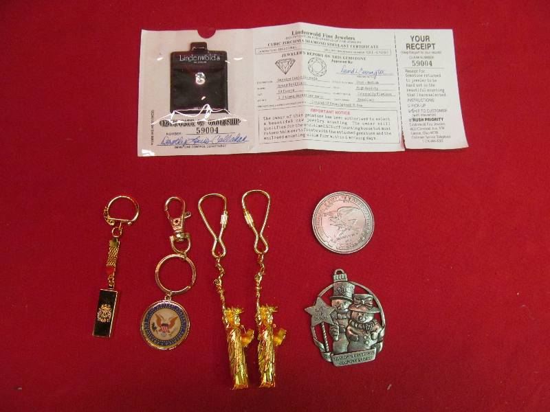 lot 165 image: Group of Key Chains from American Mint- NRA Coin, C2 Diamond Simulant