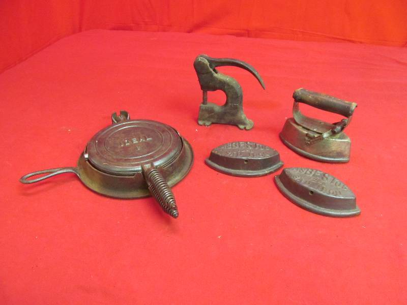 lot 194 image: Ideal No.8 Waffle Iron , 3 SAD Irons with Handle, Leather Punch