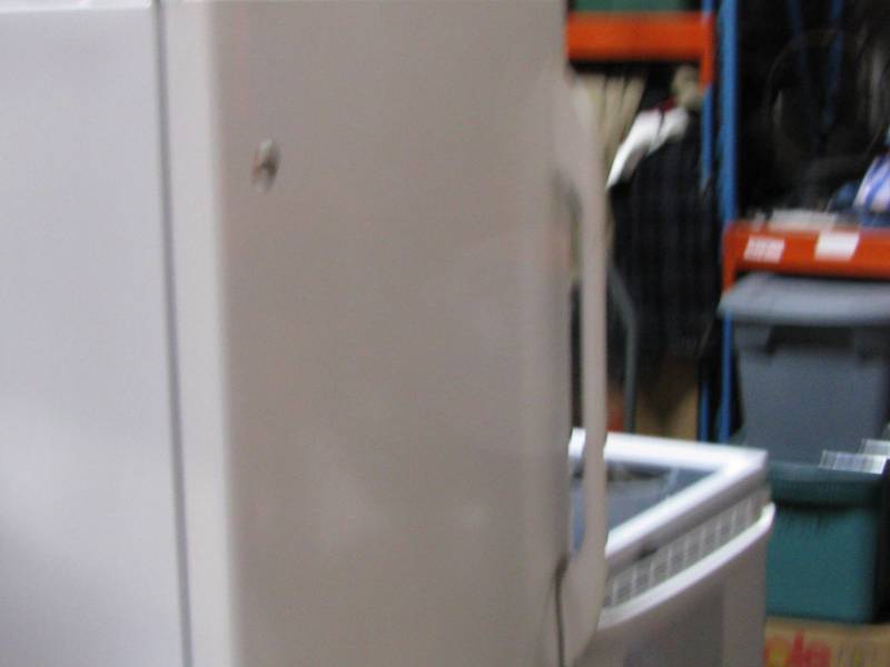 lot 9 image: G. E. Refrigerator