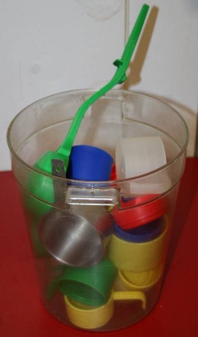 lot 50 image: Plastic Food Container and Measuring Cups