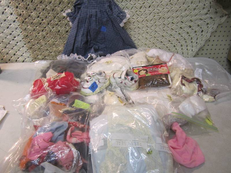 lot 54 image: Large Lot of Various Sized Doll Clo...