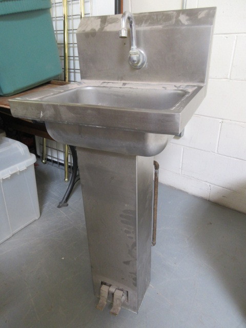 lot 917 image: STAINLESS STEEL FOOT OPERATED SINK.