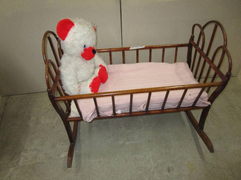 lot 92 image: Wood Crib with Blanket and Stuffed Animal