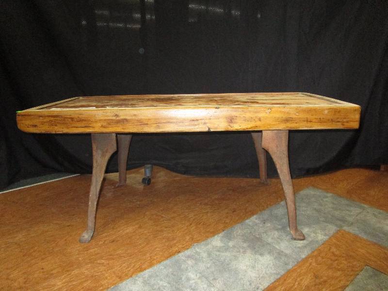 lot 165 image: coffee table w antique legs, rustic, very heavy, legs are from an old wash stand made from old barn wood. 47.5X20.25X20.5