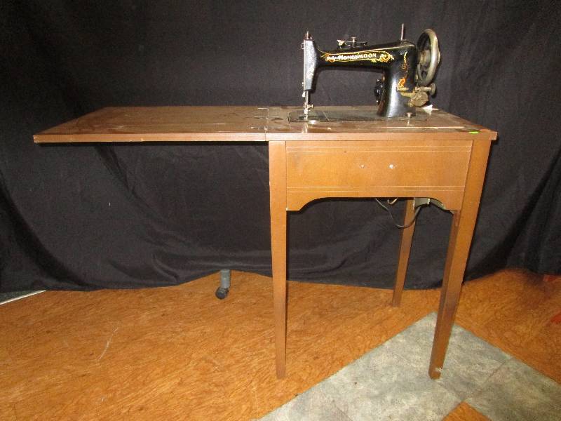 lot 166 image: Antique honey moon sewing machine, #1900807. universal sewing machine motor. Tested motor rusns, belt is loose