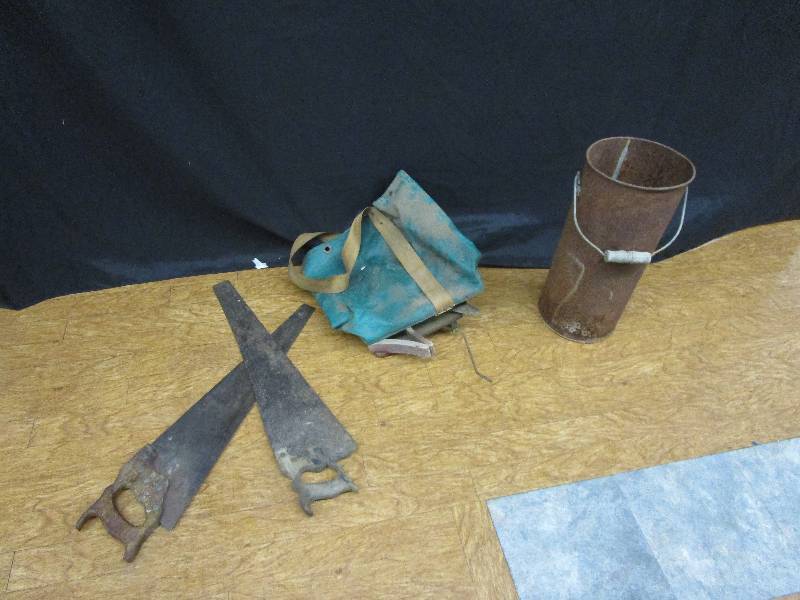 lot 185 image: antique hand seeder. 2 handsaws. Metal pale-19.5tall