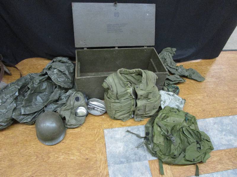 lot 188 image: trunk full of millitary stuff. Trunk is 32X16X13