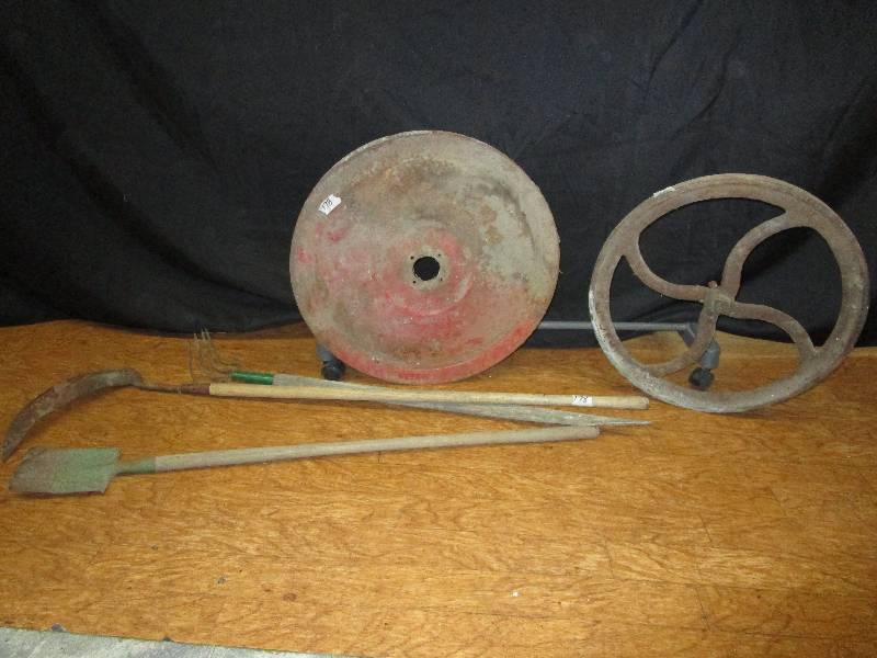 lot 190 image: hand tools and 2 pulleys. Castiron pulley is 20 other pully is 21.5