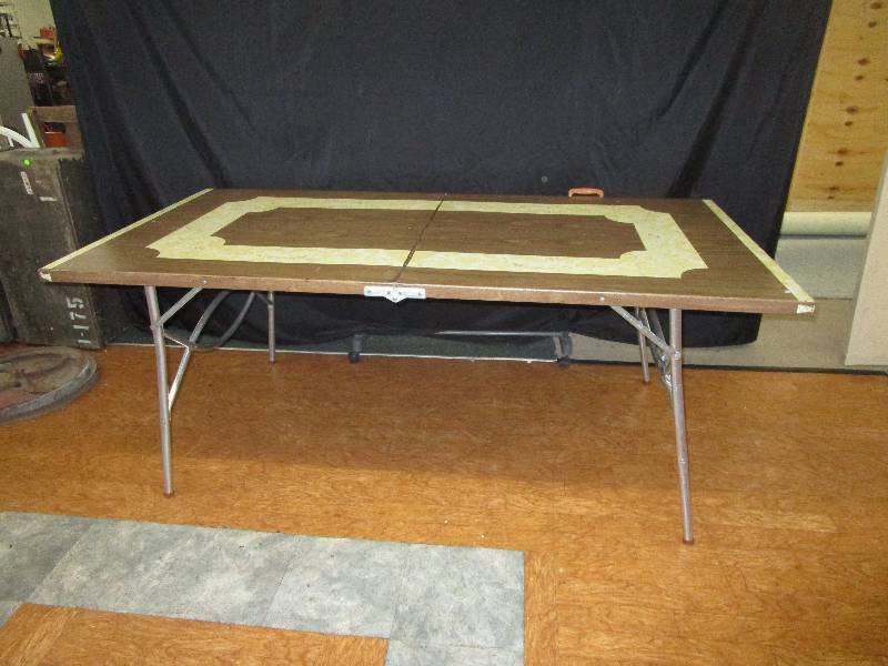 lot 191 image: Folding metal table is 65long and 36wide and 28.5 tall