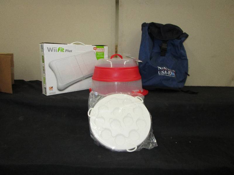 lot 69 image: Collapsible Cupcake Carrier, Nautica Backpack, WiiFIt