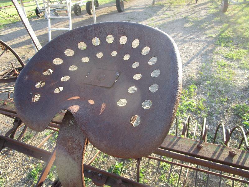 10' ANTIQUE DUMP RAKE WITH STEEL SEAT AND 54" STEEL WHEELS Lake Toys and Farm Equipment Sale