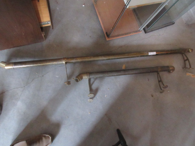 lot 102 image: BRASS FOOTRESTS FOR A BAR
