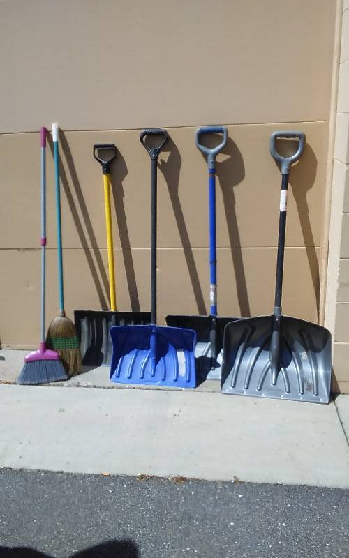 lot 25 image: 4-Plastic Snow Shovels, 2-Brooms
