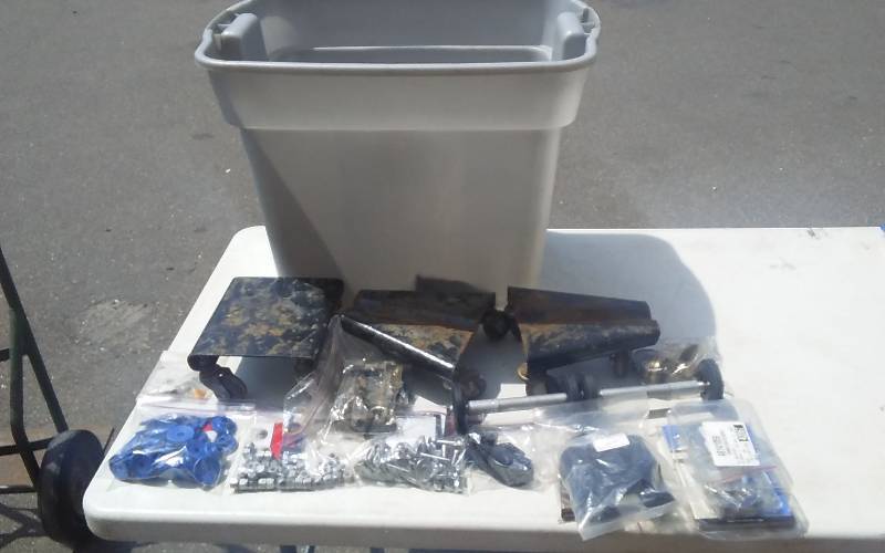 lot 47 image: Snowmobile Dollies, Studs, Bearings, Other Parts Includes Tote With Lid