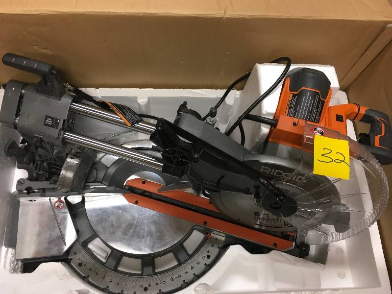 lot 32 image: RIDGID 15 Amp 12 in. Corded Dual Bevel Sliding Miter Saw with 70° Miter Capacity  USED in working conditions