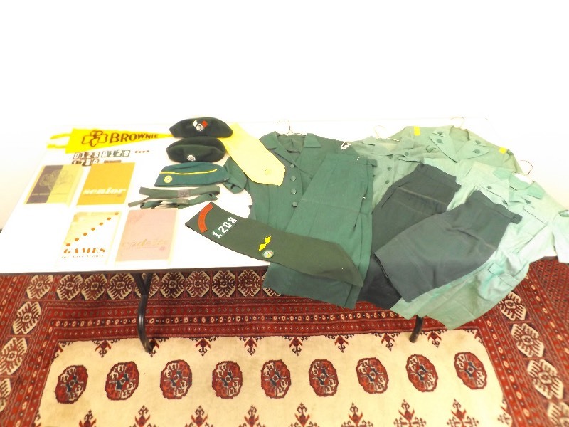 lot 37 image: Large Lot of 1950s - 1960s Girl Scout Uniforms, Pins, Hats, etc.
