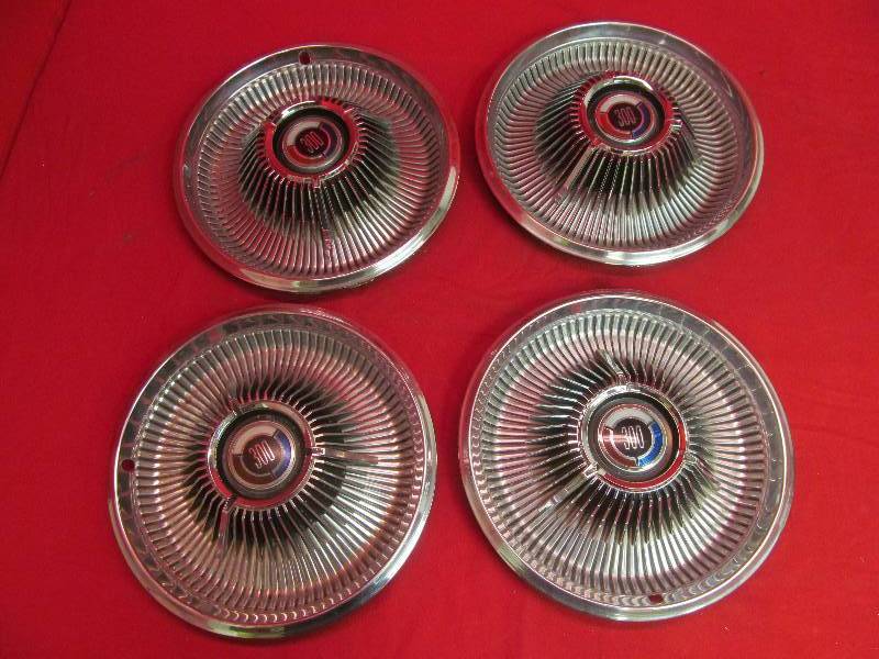lot 128 image: Set of 4 Vintage Chrysler Rims
