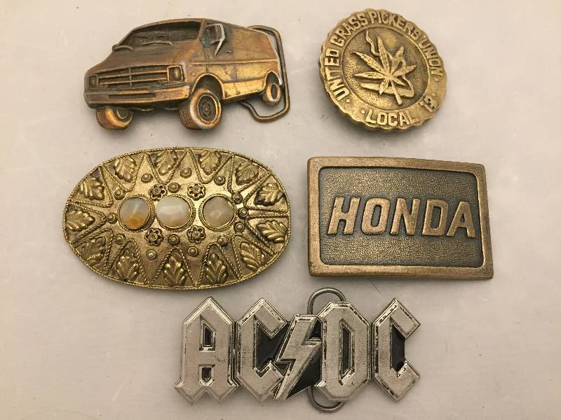 lot 77 image: Belt Buckles - AC DC Van Honda Grass More