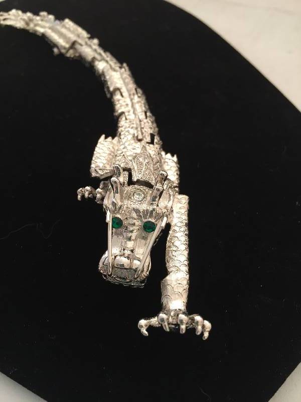 lot 65 image: 7 Dragon Brooch - Moveable bodylimbs