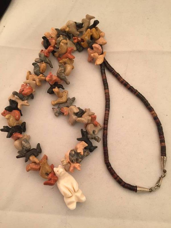 lot 66 image: Necklace - Carved Animal