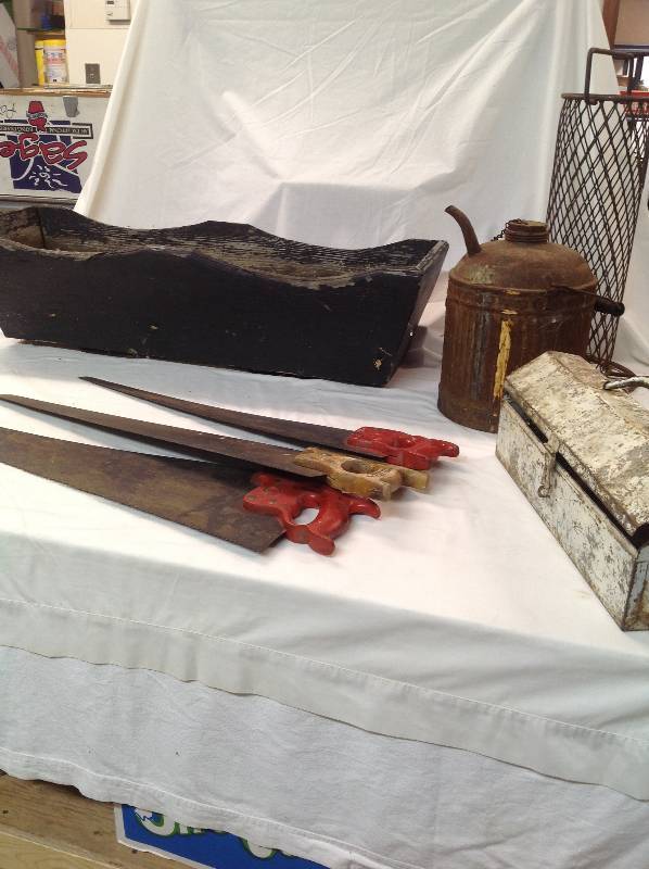 lot 94 image: Three Saws, Wooden Planter, Tool Box and an Antique Oil Container