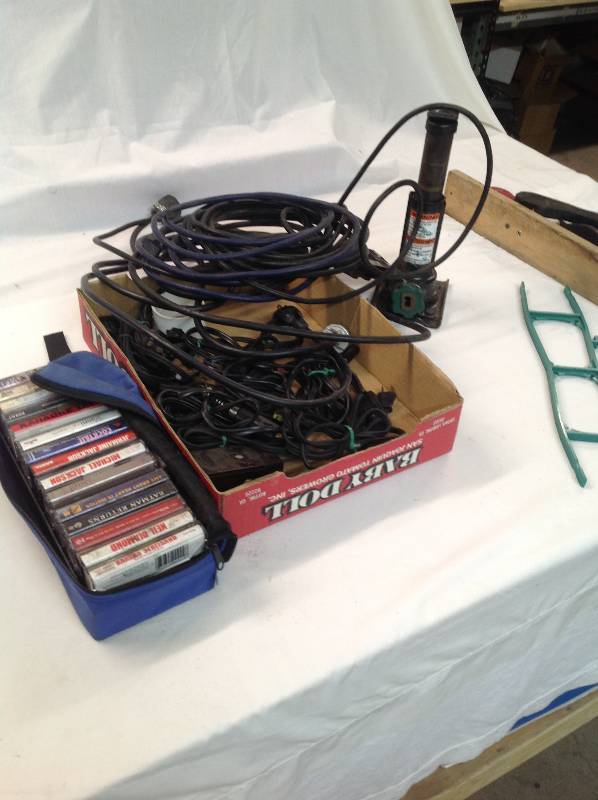 lot 79 image: Cassette Tapes, Power cords, Extension Cord, Jack, Knocker