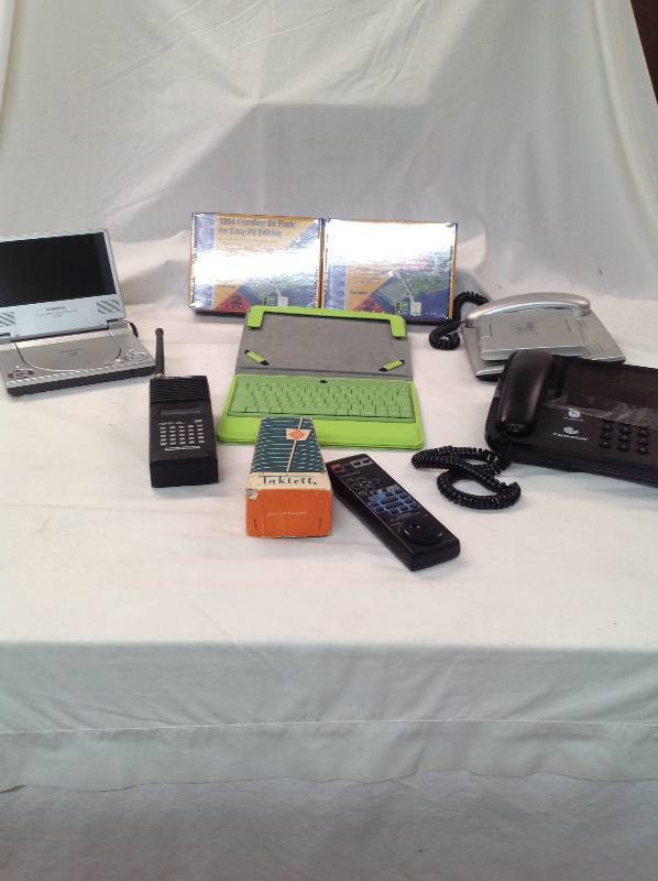 lot 89 image: Small Portable DVD player - IPad Case - 2 Dv Editing Packs - Two other Phones