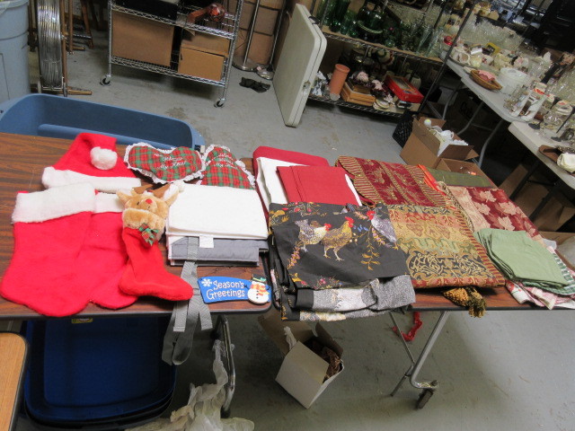 lot 332 image: HOLIDAY TABLE CLOTHS, RUNNERS, STOCKINGS AND MORE