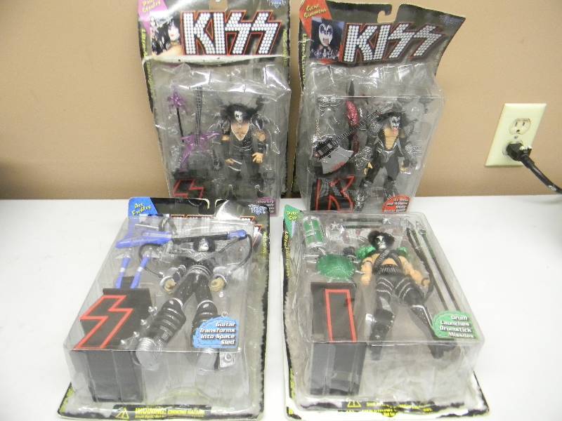 lot 41 image: VINTAGE McFARLANE KISS FIGURES GENE, PAUL, PETER & ACE - BOXES ARE ROUGH BUT FIGURES ARE IN NEW CONDITION - SEE PICTURES