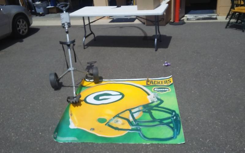 lot 51 image: Packers 50x54 Fathead Wall Cling, Rolling Golf Bag Cart