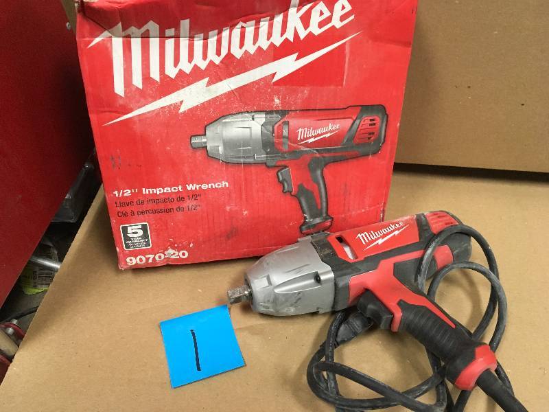 Milwaukee 12 in. Impact Wrench with Rocker Switch and Detent Pin Socket Retention use in working condition