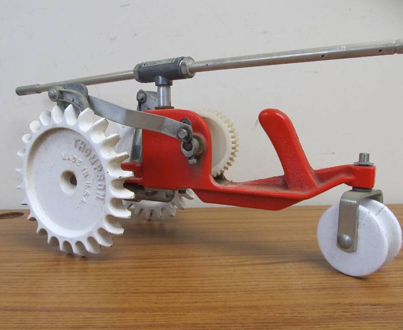 lot 198 image: Vintage Cast Iron THOMPSON Walking Tractor Sprinkler