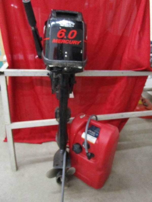 lot 8 image: Boat Motor Mercury 6ML This motor runs and has been run through the marine shop, ready for the water