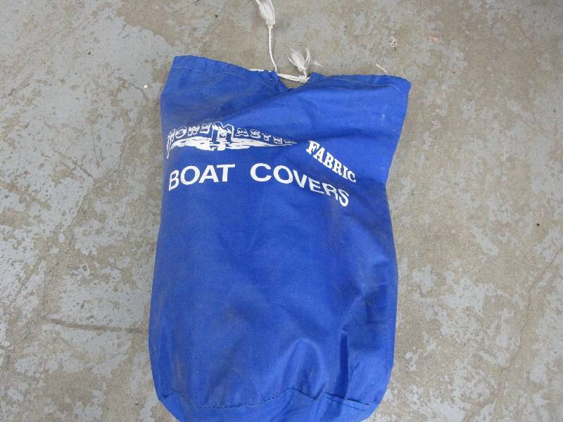 lot 108 image: 18 ft Canvas Boat Cover and Motor Cover Unused