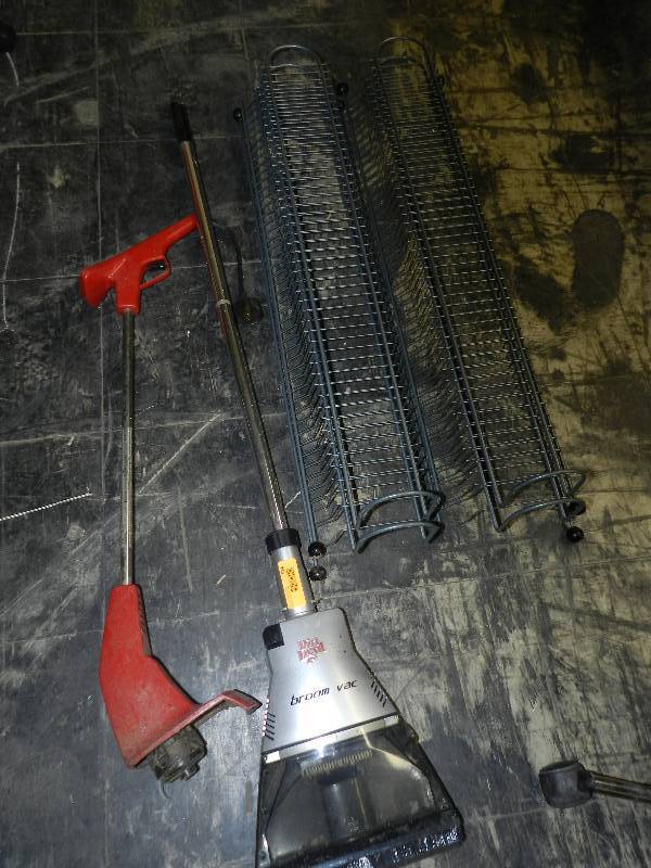 lot 534 image: DIRT DEVIL BROOM VAC, ELECTRIC WEED WACKERS AND METAL STORAGE RACKS FOR VIDEOS