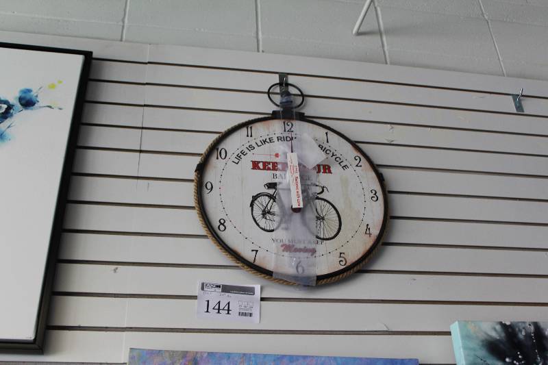lot 144 image: Life Is Like Riding A Bicycle To Keep Your Balance You Must Keep Moving Wall Clock