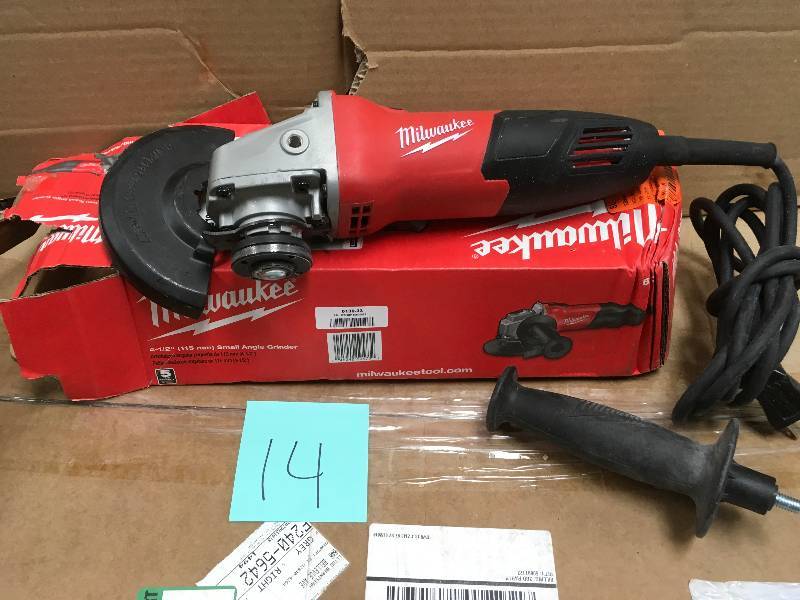 MILWAUKEE 7 Amp Corder 4-12 in. Small Angle Grinder with Sliding Lock-On Switch in working conditions