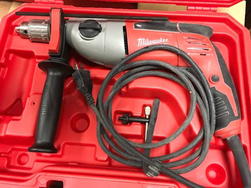 MILWAUKEE 12 in. Heavy-Duty Hammer Drill in working conditions