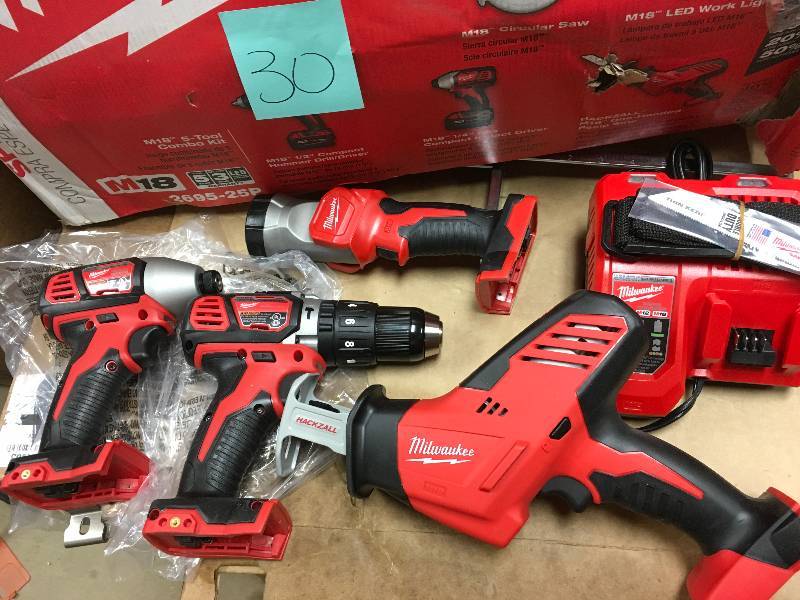 MILWAUKEE M18 18-Volt Lithium-Ion Cordless Combo Tool Kit (5-Tool) with Two Batteries, One Charger, One Tool Bag in like new working conditions