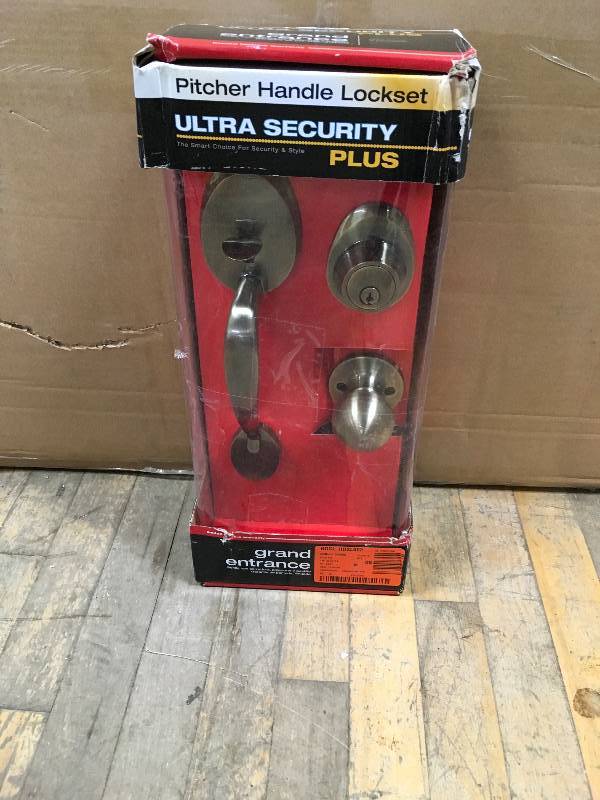 lot 28 image: Cheltenham Antique Brass Door Handleset and Single Cylinder Deadbolt not used