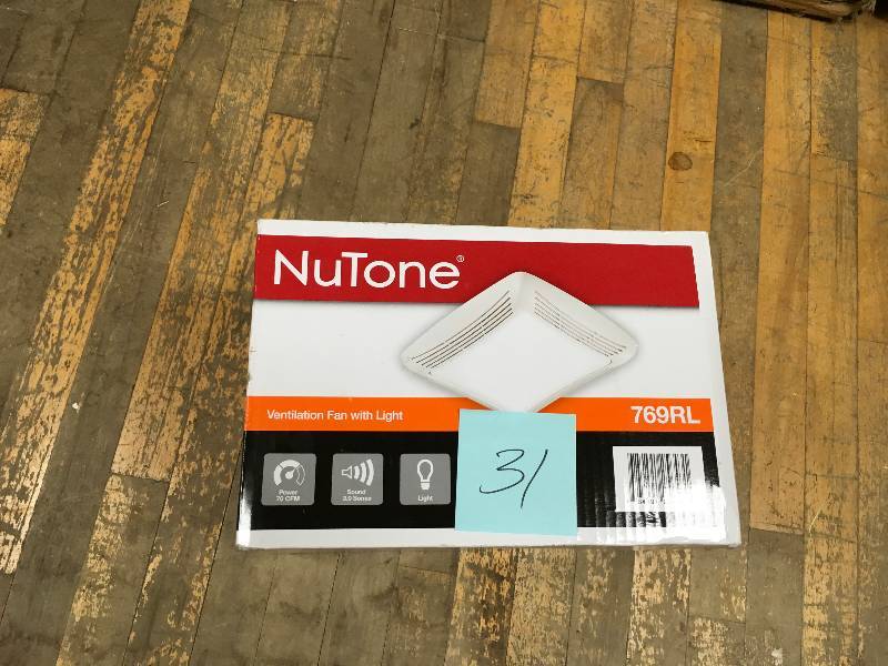 lot 31 image: NuTone 70 CFM Ceiling Exhaust Fan with Light, White Grille and Bulb not used